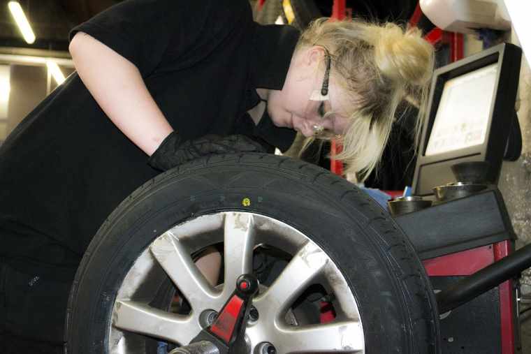 female tyre fitter