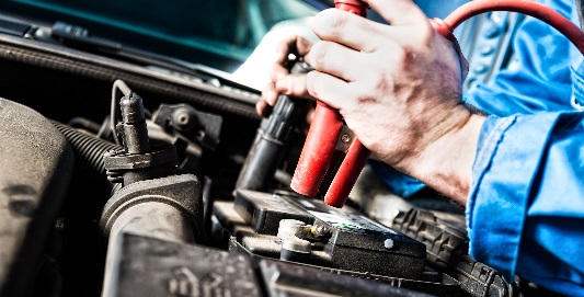 Man opening car bonnet to check battery 