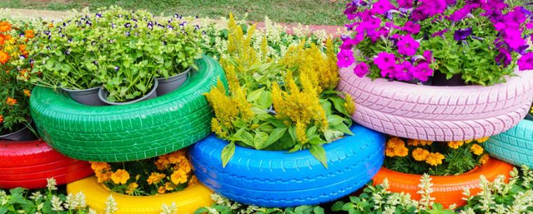 tyres filled with plants and stacked on top of each other