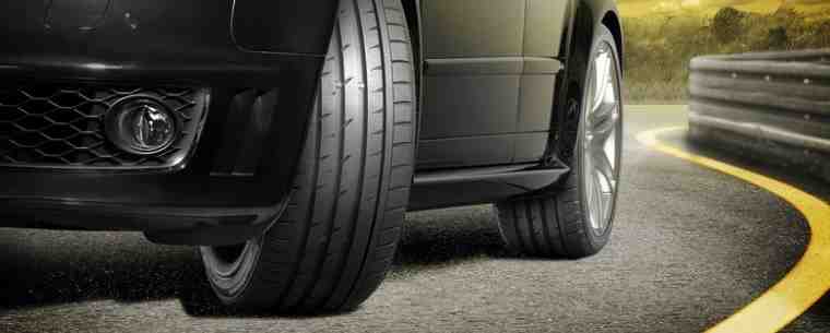 Car with tyre tread showing on road.