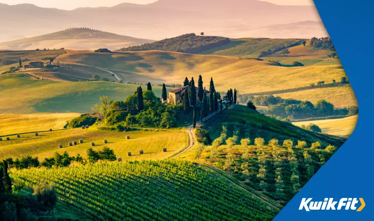 A view of the beautiful hills of Tuscany at sunset.