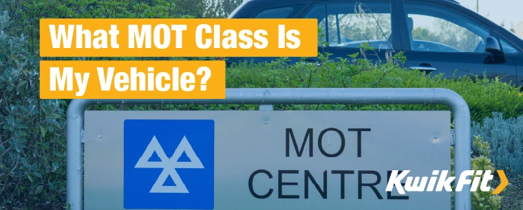 MOT centre sign with a parked car outside.