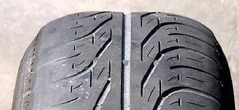 tyre tread worn on outside edge