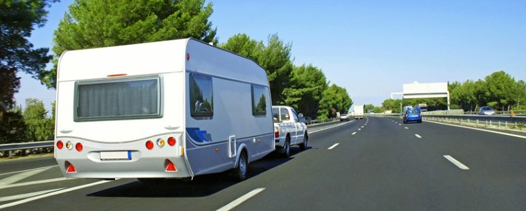 a caravan being driven on the motorway