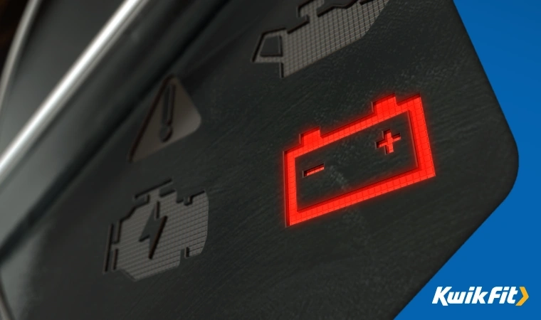 Close up of battery warning light on a dashboard.