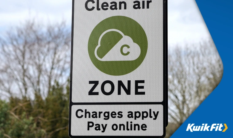 A road sign displays that drivers are now entering a clean air zone and will have to pay a charge.