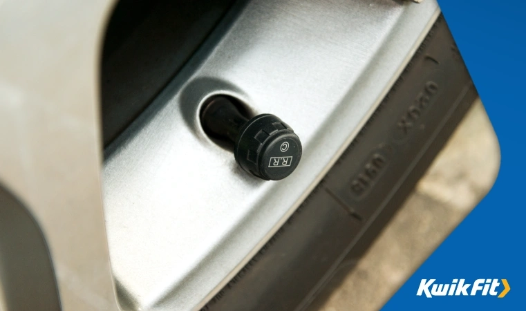 A tyre pressure cap is fitted securely onto a tyre.