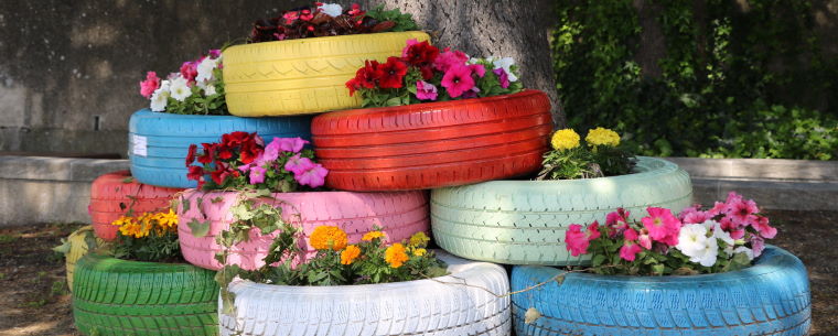 Multi coloured tyre planters 