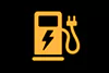 battery range low warning light on car dashboard