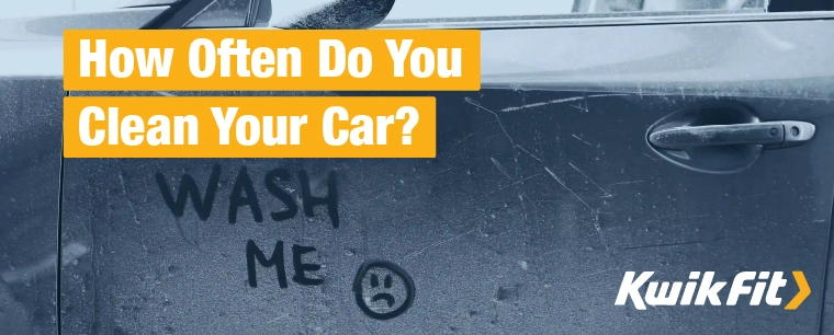 'Wash me' written into the muck on the side of a car.