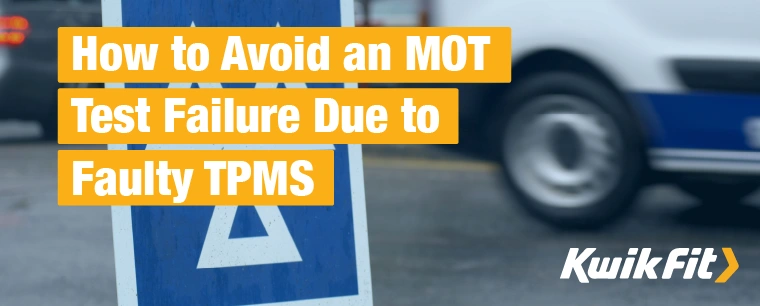 A blue and white MOT testing centre sign made up of three triangles.