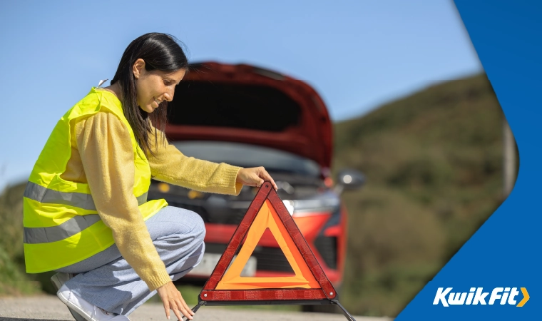 keep a hazard triangle and a high visibility vest in the car