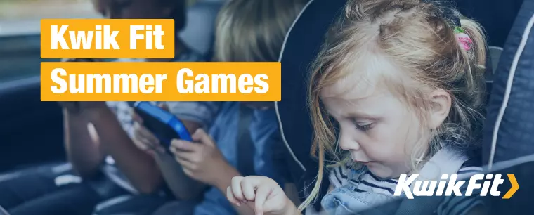 Image of kids playing games on devices in the back of a car.