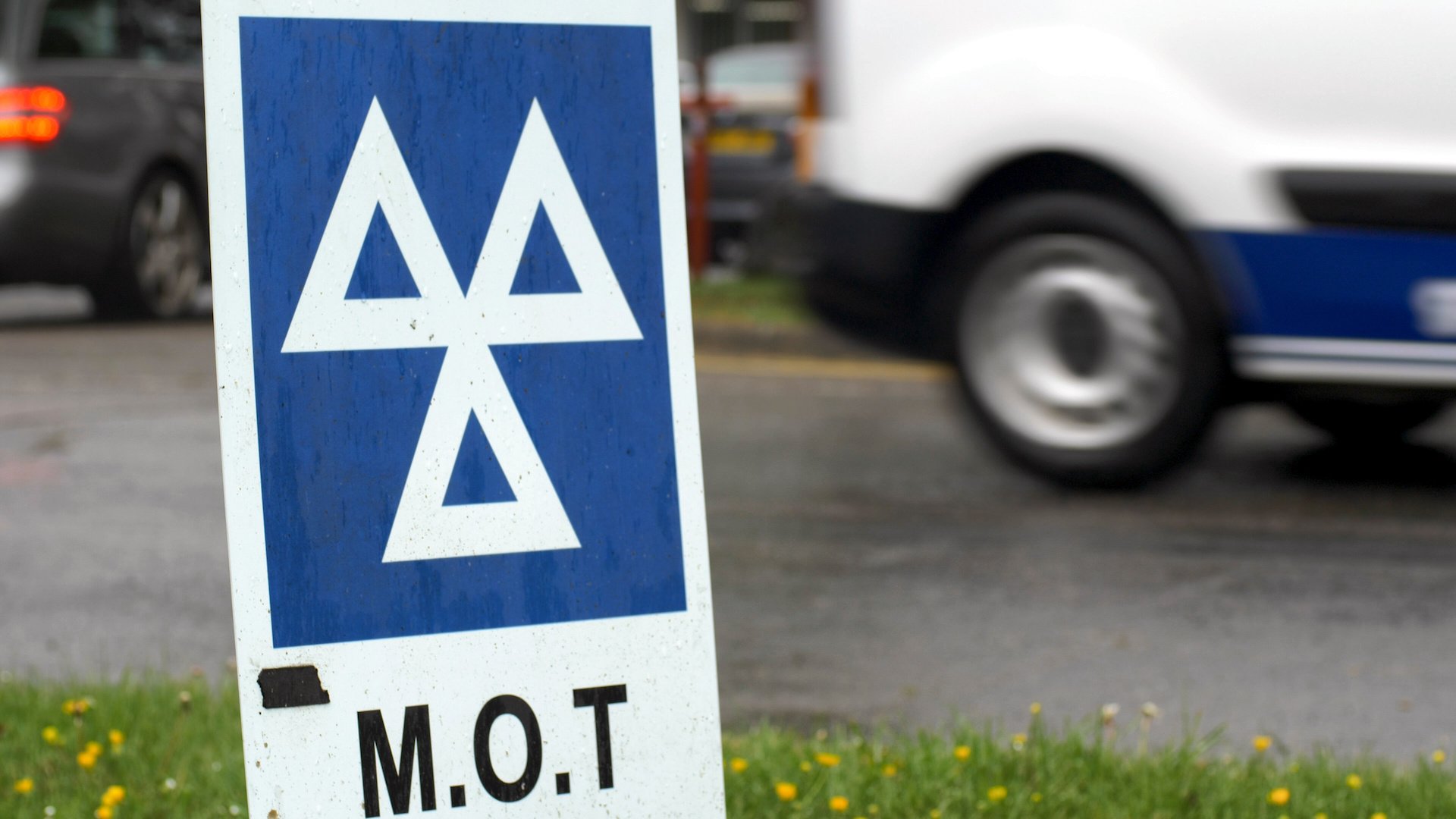 MOT test centre sign on the side of a road.