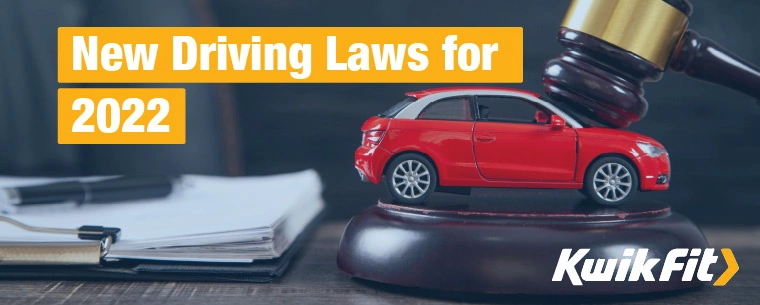 Model car sits on desk with a judge's gavel resting on it, symbolising car legislation.