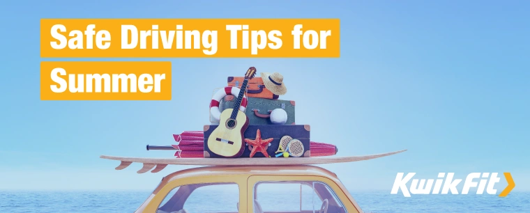Yellow Volkswagen Beetle with summertime objects stacked on top of it like a surfboard, beach umbrella, guitar, and beach games.