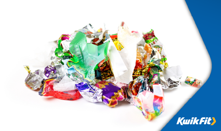 Empty sweet wrappers piled up.