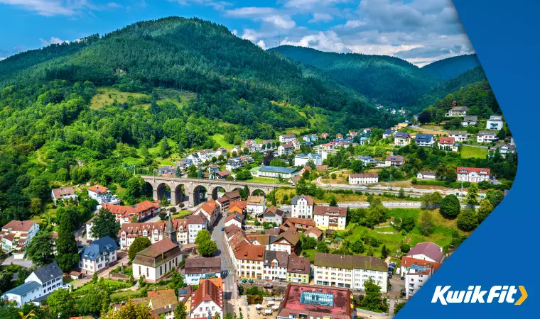 An aerial view of a town in Germany's verdant Black Forest with typical south-eastern German architecture.