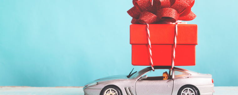Toy car with a wrapped present