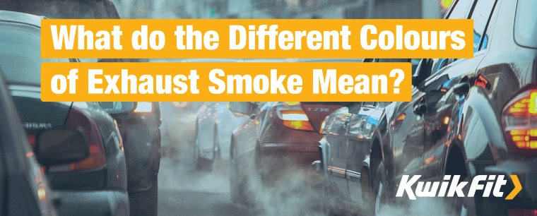 Cars sit in traffic as exhaust smoke drifts between them.
