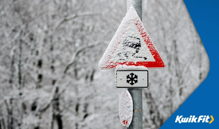 winter slippery road sign