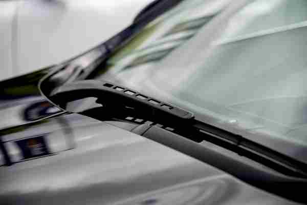 Wiper blades on the windscreen of a car during an MOT test